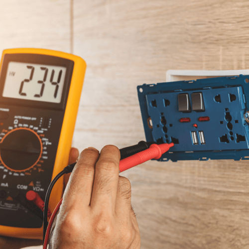 GFCI tester being plugged into a wall