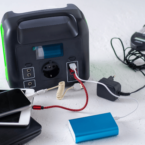 Black power block with multiple devices charging.