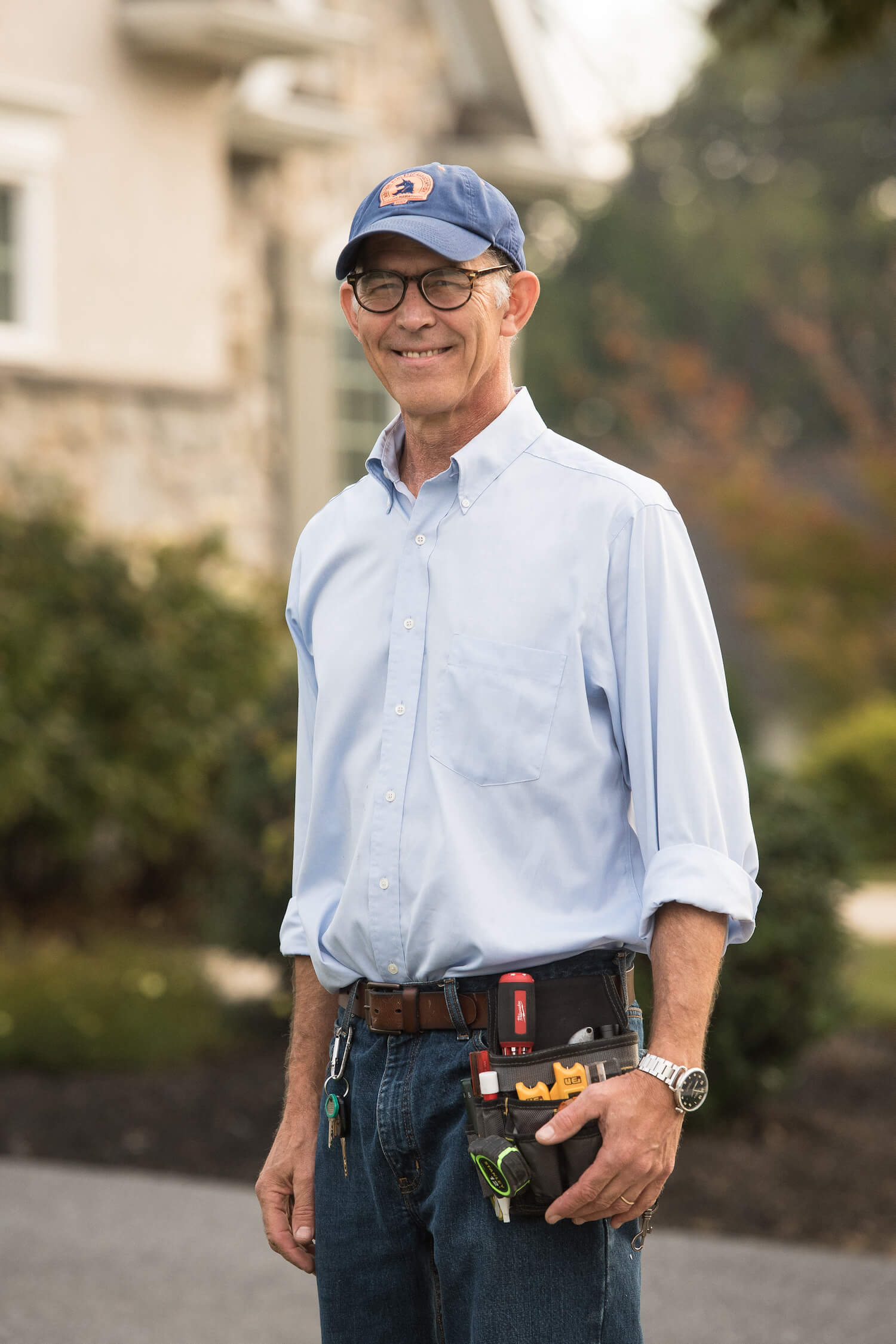 A home inspector wearing a toolbelt.